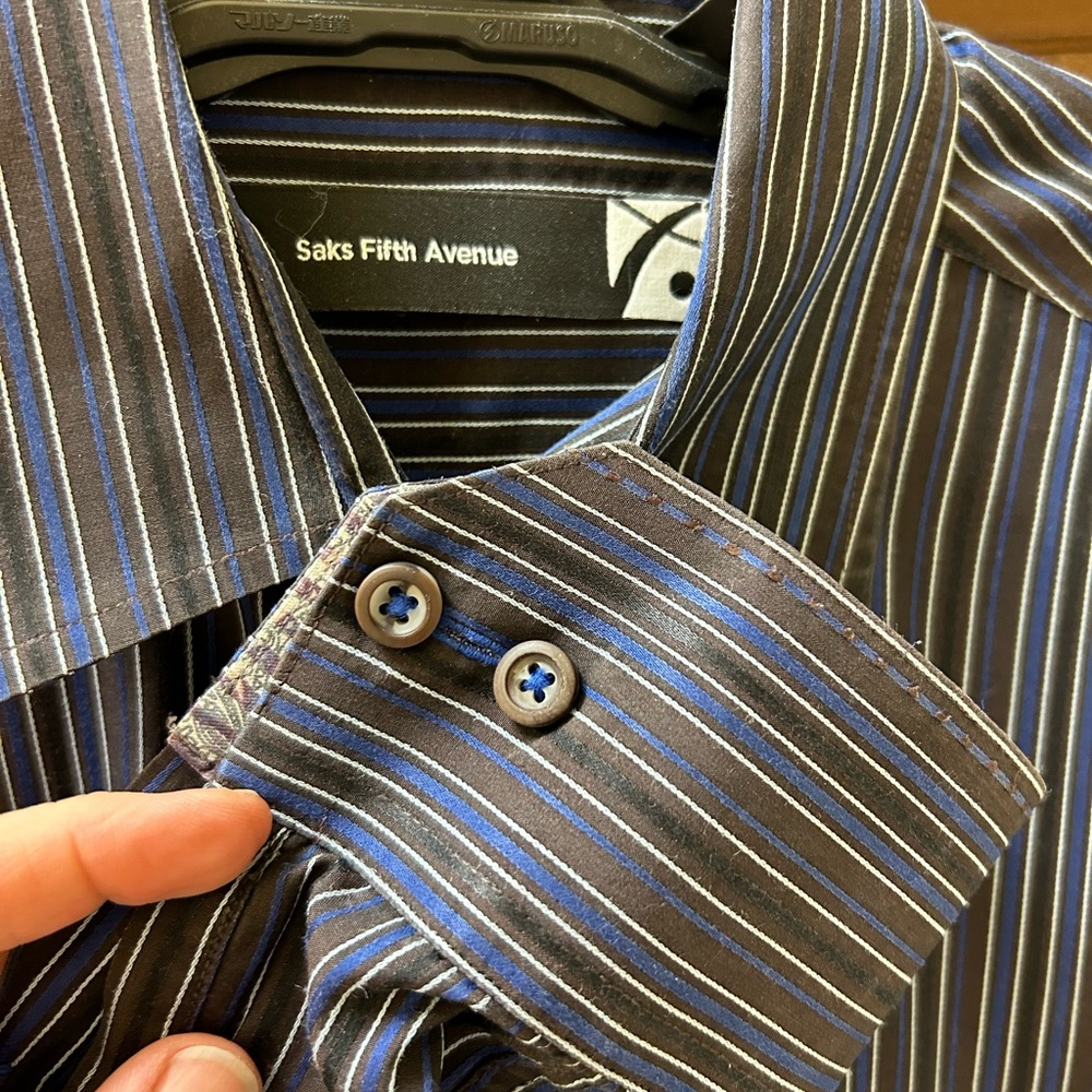 Like NEW Saks button down perfect for a night out. Reversible cuffs add flair.